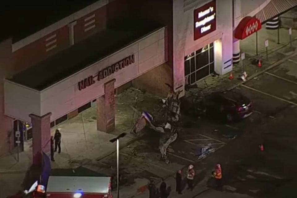 <p>Fox 4 Dallas-Fort Worth/YouTube</p> A pilot died after a fiery plane crash in the parking lot of a Texas shopping mall 