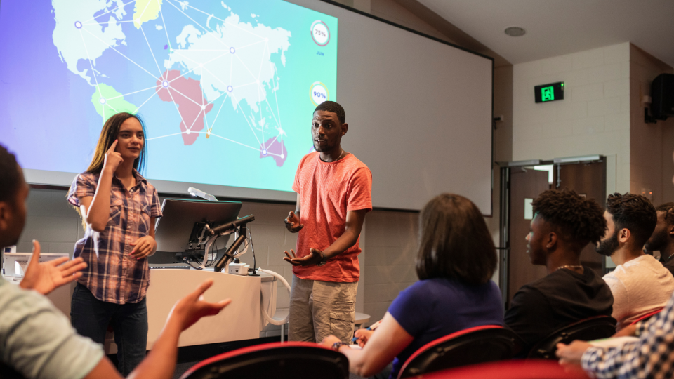 University students making a presentation. 