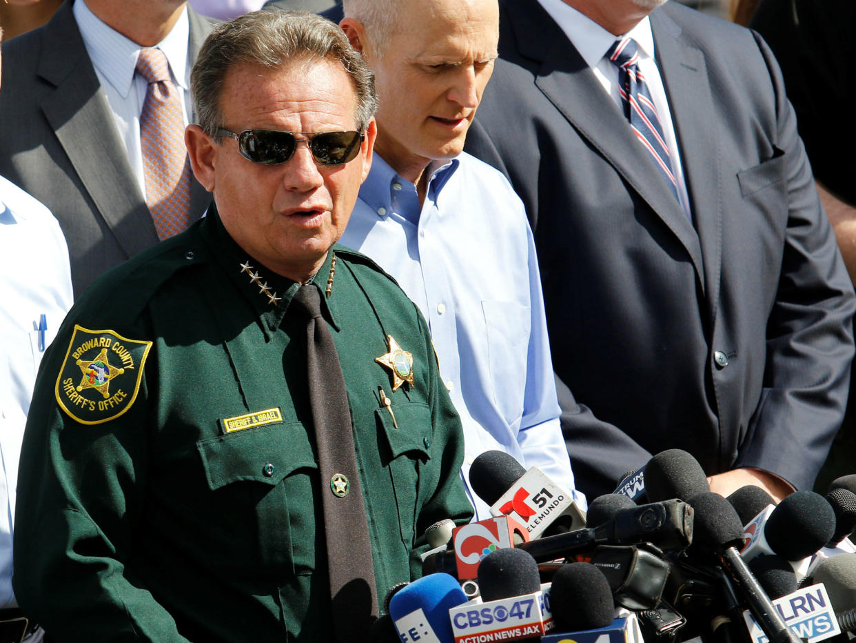 Mr Israel pictured here at a press conference following the shooting: REUTERS/Thom Baur