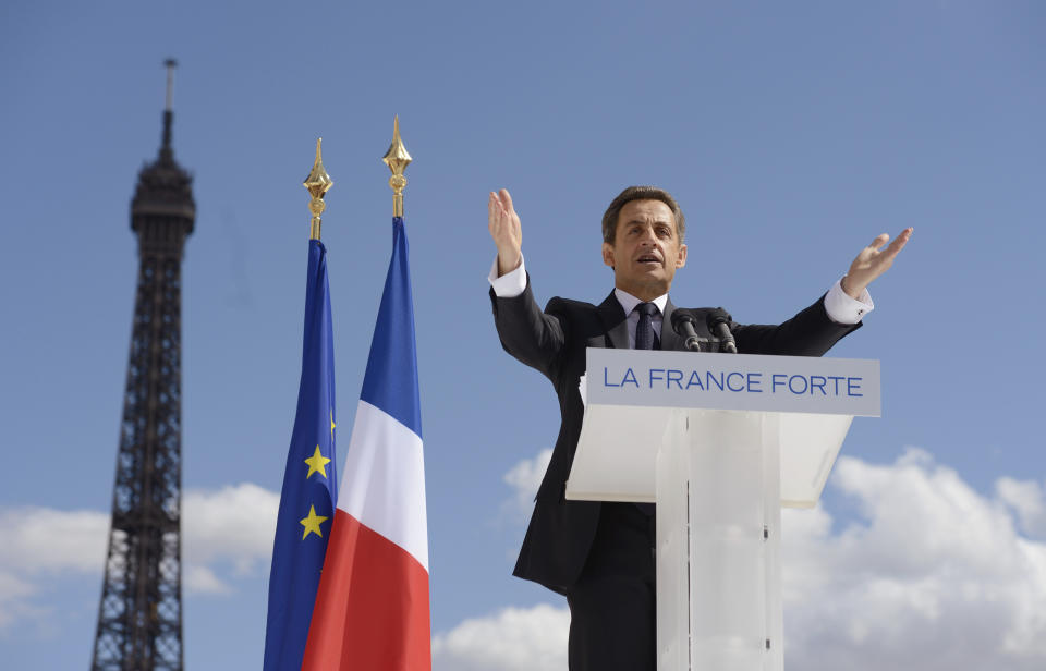 FILE - In this May 1, 2012 file photo, French President and conservative candidate for re-election in the 2012 French presidential elections Nicolas Sarkozy delivers a speech during a campaign rally in front the Eiffel Tower in Paris. Former President Sarkozy is scheduled to go on trial Wednesday, March 17, on charges that his unsuccessful reelection bid in 2012 was illegally financed.(Eric Feferberg, Pool via AP, File)