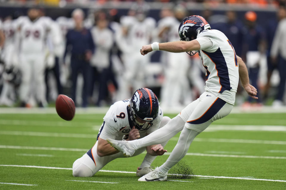 Denver Broncos place kicker Wil Lutz kicks a 34-yard field goal as Riley Dixon (9) holds in the first half of an NFL football game against the Houston Texans Sunday, Dec. 3, 2023, in Houston. (AP Photo/Eric Christian Smith)