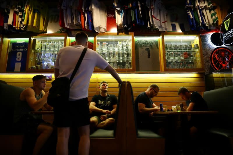 Soccer fan patrons are seen at the Adega Sports Bar as thousands of English fans start arriving to Portugal's northern city of Porto for the Champions League final and hotels and bars hope for a boost after the tourism sector was ravaged by the coronavirus