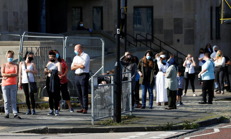 People queue outside a test center to take a coronavirus test in Bolton, in the northwest of England, Sept. 17. At more than 40,000, the U.K.'s COVID-19 death toll is the highest in Europe. (Photo: Phil Noble / reuters)