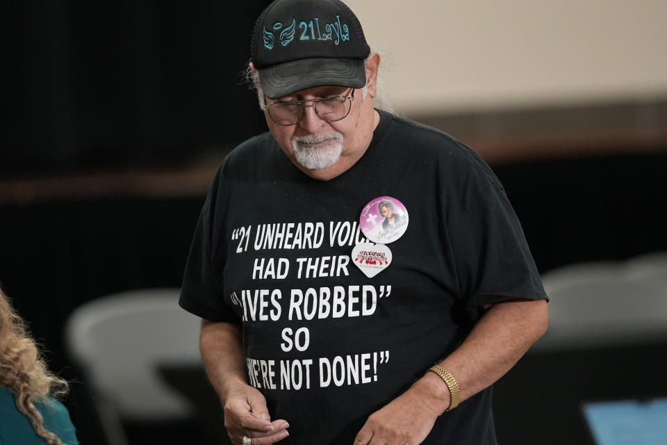 A resident arrives for a news conference with families of the victims of the Uvalde elementary school shooting, Wednesday, May 22, 2024, in Uvalde, Texas. The families of 19 of the victims announced a lawsuit against nearly 100 state police officers who were part of the botched law enforcement response. The families say they also agreed a $2 million settlement with the city, under which city leaders promised higher standards and better training for local police. (AP Photo/Eric Gay)