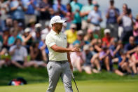 Xander Schauffele walk on the eighth green during the second round of the Travelers Championship golf tournament at TPC River Highlands, Friday, June 24, 2022, in Cromwell, Conn. (AP Photo/Seth Wenig)