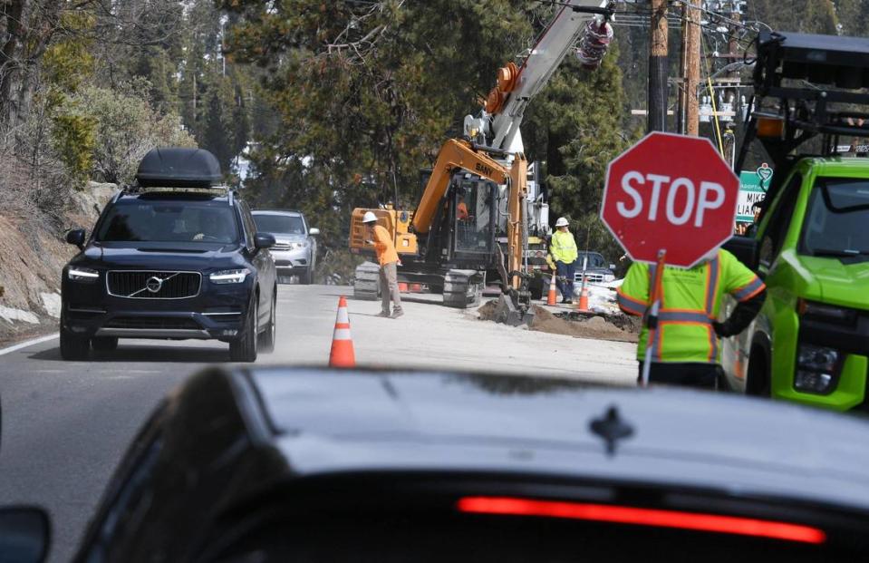 Traffic is reduced to one lane along Highway 168 as road repairs are conducted near the Shaver Lake dam Friday afternoon, March 17, 2023.