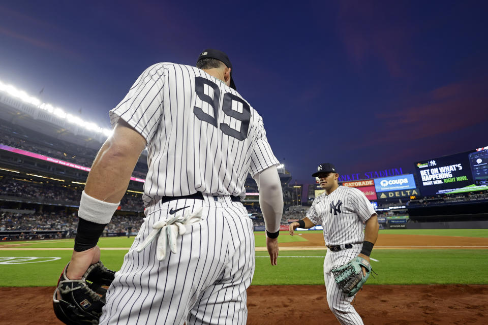 New York Yankees right fielder Aaron Judge (99) waits for Jasson Dominguez during the second inning of a baseball game against the Detroit Tigers, Tuesday, Sept. 5, 2023, in New York. (AP Photo/Adam Hunger)
