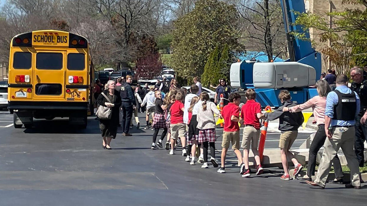 Children are evacuated after a mass shooting at the Covenant School in Nashville, Tenn., on Monday. (AP Photo/Jonathan Mattise)