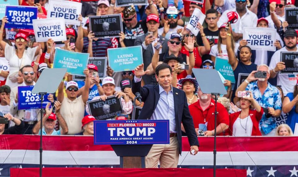 Florida U.S. Senator Marco Rubio waves to supporters on Tuesday before speaking at a Trump rally at the Trump National in Doral