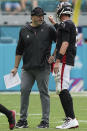 Atlanta Falcons head coach Arthur Smith talks with Atlanta Falcons quarterback Matt Ryan (2), during the second half of an NFL football game, Sunday, Oct. 24, 2021, in Miami Gardens, Fla. (AP Photo/Hans Deryk)