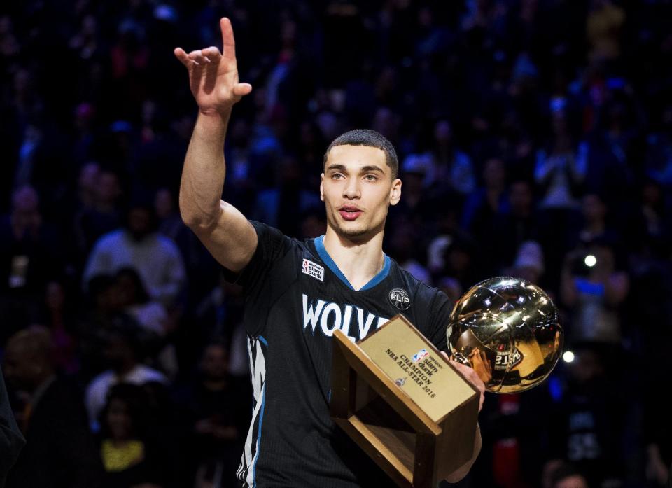 FILe - In this Feb. 13, 2016, file photo, Minnesota Timberwolves' Zach LaVine holds the trophy after winning the slam dunk contest during the NBA basketball All-Star weekend in Toronto. What was perhaps the best dunk contest in All-Star weekend history will not get a rematch. LaVine says he will not return to the event to try to win it for a third straight year. (Mark Blinch/The Canadian Press via AP, File)