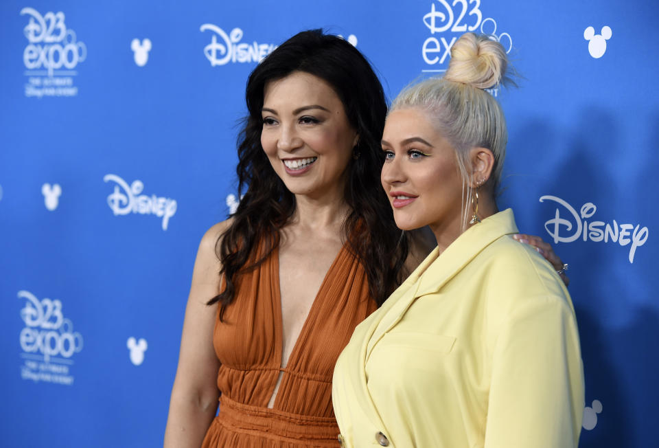 Actress Ming-Na Wen, left, and singer Christina Aguilera pose together at the Disney Legends press line during the 2019 D23 Expo, Friday, Aug. 23, 2019, in Anaheim, Calif. (Photo by Chris Pizzello/Invision/AP)