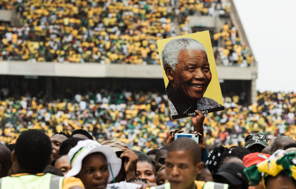 An African National Congress (ANC) supporter holds a poster of former President Nelson Mandela during the ANC Election Manifesto launch at the Moses Mabhida Stadium in Durban, South Africa, in a Feb. 24, 2024 file photo. / Credit: RAJESH JANTILAL/AFP/Getty