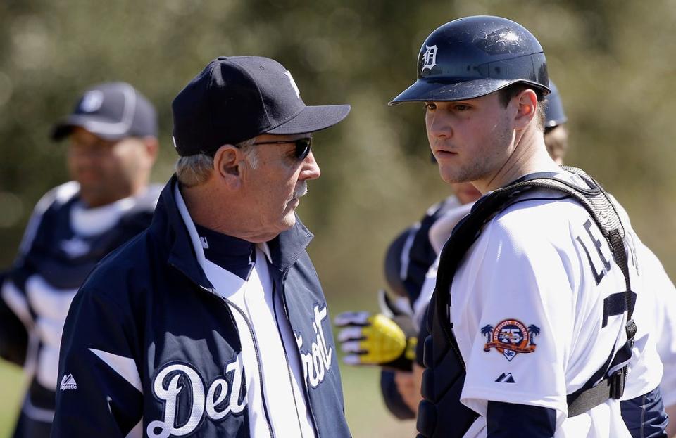 Detroit Tigers manager Jim Leyland, left, talks with his son, catcher Patrick Leyland, right, during a spring training baseball workout Monday, Feb. 14, 2011, in Lakeland, Fla. (AP Photo/David J. Phillip)