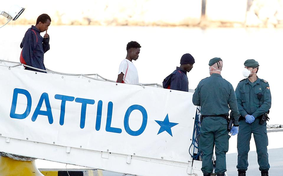 Boat with hundreds of refugees on board arrives at Spanish port after being turned away by other European countries