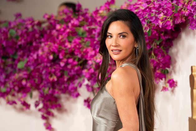 Olivia Munn on the red carpet of the 2024 Oscars. She opened up about her experience with breast cancer in a new interview with People.