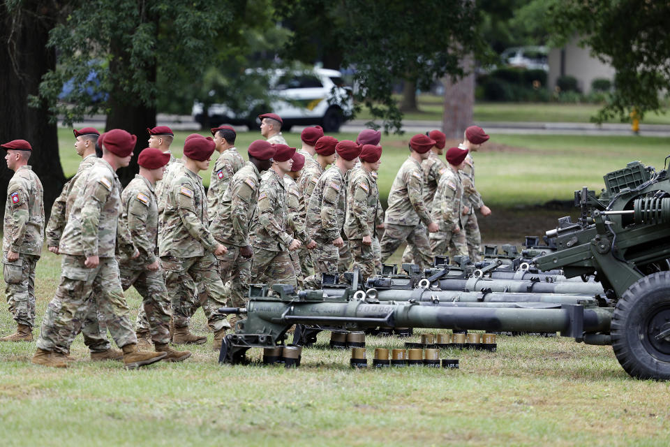 Crews man their guns during a 15-gun salute as a part of the ceremony to rename Fort Bragg, Friday, June 2, 2023 in Fort Liberty, N.C. The U.S. Army changed Fort Bragg to Fort Liberty as part of a broader initiative to remove Confederate names from bases. (AP Photo/Karl B DeBlaker)