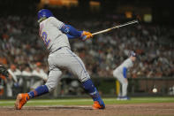 New York Mets' Francisco Lindor hits a three-run triple against the San Francisco Giants during the eighth inning of a baseball game in San Francisco, Tuesday, May 24, 2022. (AP Photo/Tony Avelar)