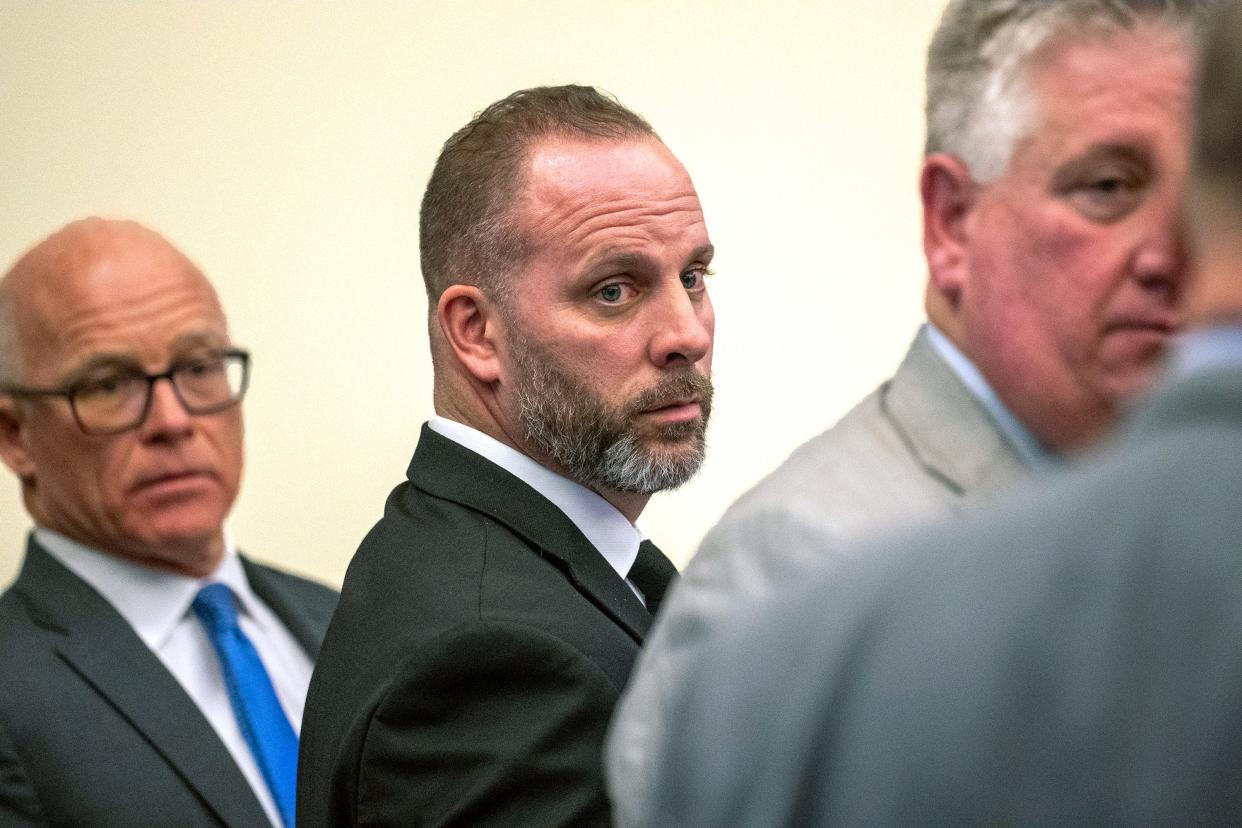 Jan 31, 2024; Columbus, Ohio, USA; Former Franklin County Sheriff's office deputy Jason Meade (center) stands with two of his Defense Attorneys Steve Nolder (left) and Mark Collins. Meade, 45, is charged with murder and reckless homicide in the Dec. 4, 2020, death of Casey Goodson Jr.