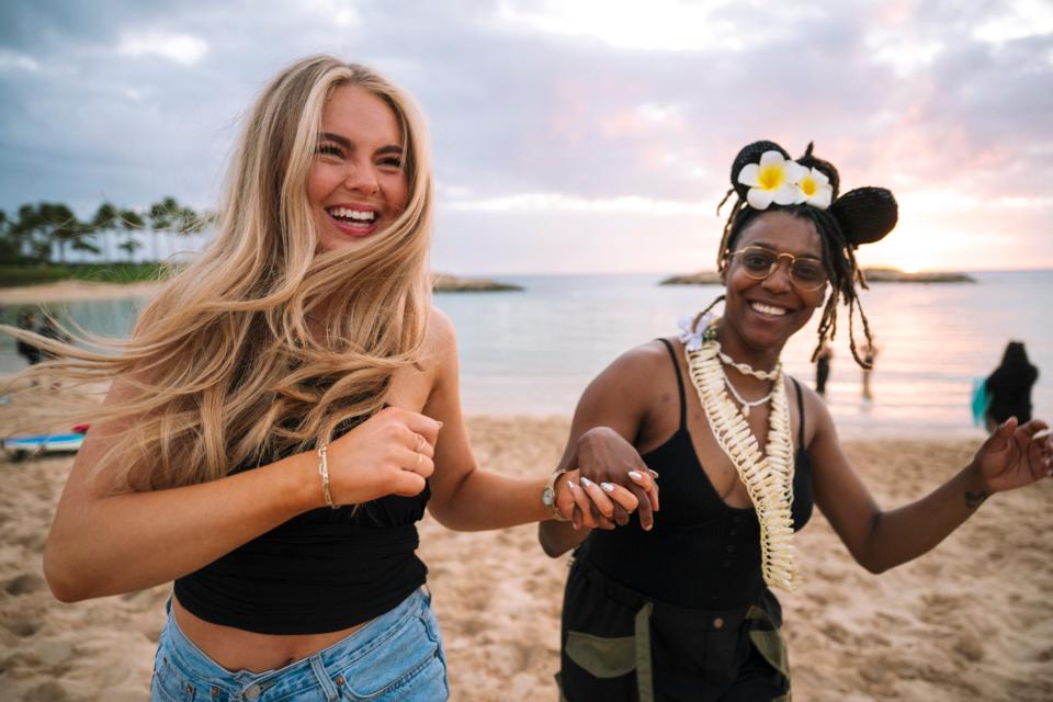 Elleigh Marie, left, and KBlocks on the beach at at Disney's Aulani Resort in Hawaii.