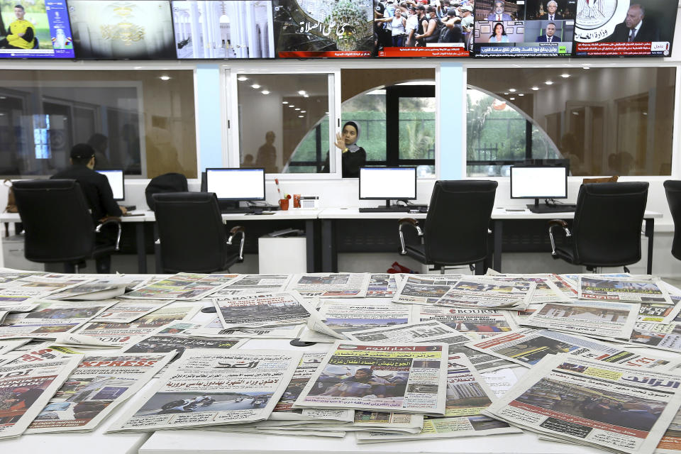 Newspapers rest on a table at a private television broadcaster in Algiers, Tuesday, March 19, 2024. Algerian officials are chiding television stations over the content choices they've made during Ramadan. Their criticisms come amid broader struggles facing journalists and broadcasters, which have historically relied heavily on advertising from the state and Sonatrach, its largest oil and gas company. (AP Photo/Anis Belghoul)