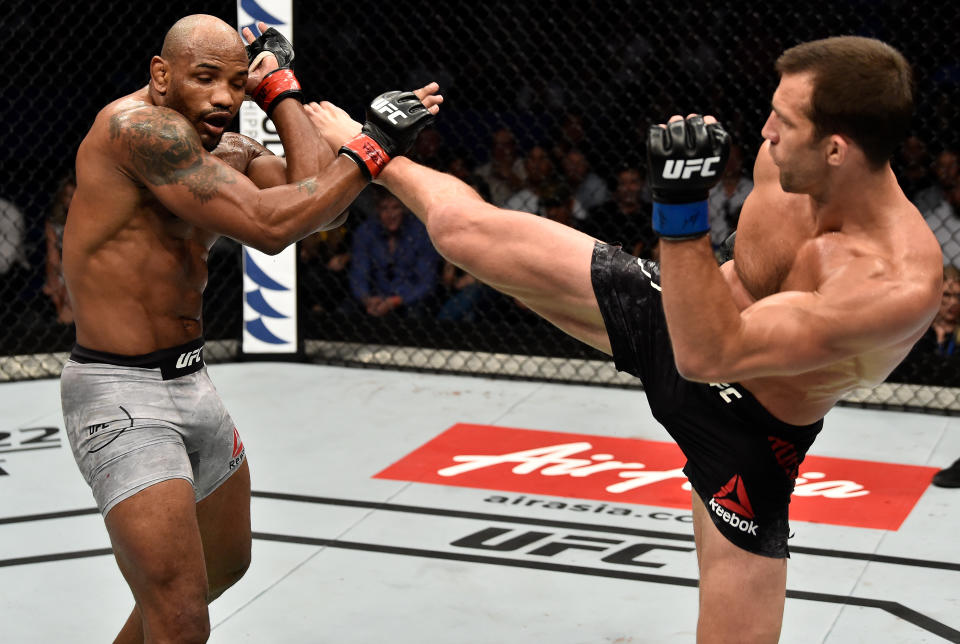 PERTH, AUSTRALIA - FEBRUARY 11:  (R-L) Luke Rockhold kicks Yoel Romero of Cuba in their interim middleweight title bout during the UFC 221 event at Perth Arena on February 11, 2018 in Perth, Australia. (Photo by Jeff Bottari/Zuffa LLC/Zuffa LLC via Getty Images)