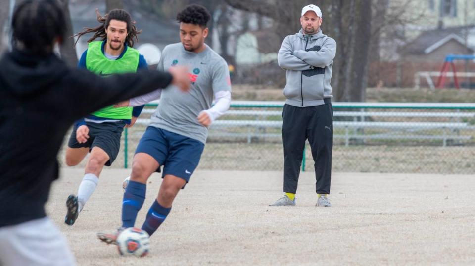 Ehtar Belleville Football Club’s head coach Drew Crawford watches players during an open tryout. The Ehtar Belleville Football Club has joined the The National Premier Soccer League (NPSL). The club will begin league play in May. For more information about the team visit www.ehtarfc.com.