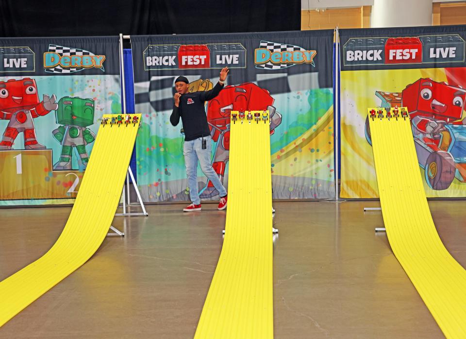 Kid-built cars are ready to race at Brick Fest Live featuring life-sized models made from Legos, hands-on activities, and a meet-and-greet with Manny from the "Lego Masters" TV show at the Iowa Events Center in Des Moines on Saturday, Feb. 17, 2024.