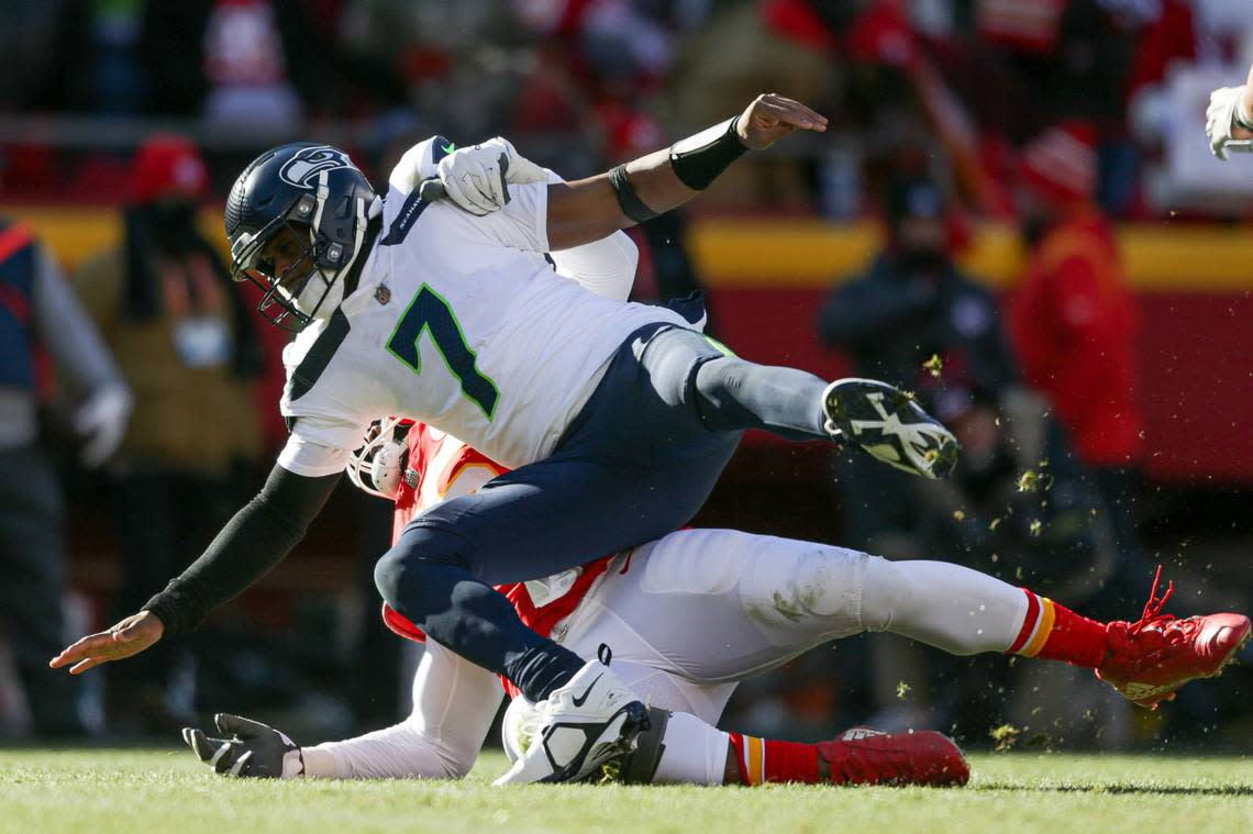 Seattle Seahawks quarterback Geno Smith (7) is hit by Kansas City Chiefs defensive tackle Chris Jones (95) during the second quarter on Saturday, Dec. 24, 2022, in Kansas City, MO.