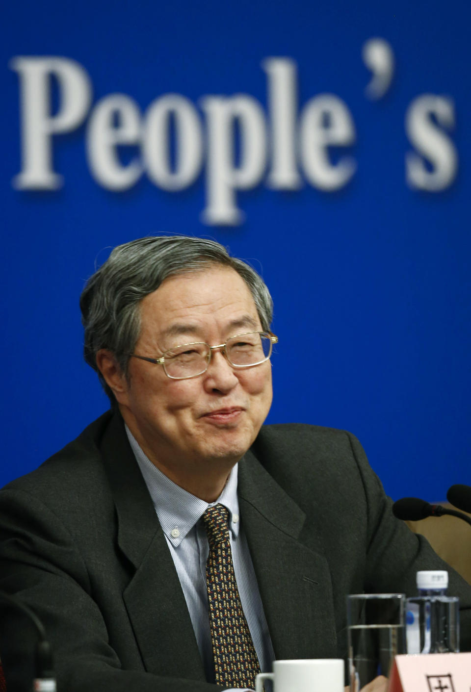 People's Bank of China governor Zhou Xiaochuan speaks at a press conference during the National People's Congress at the media center in Beijing, China, Tuesday, March 11, 2014. Zhou said Beijing might finish the process of easing controls on interest rates within two years and market forces will set the pace for allowing use of its tightly controlled currency abroad. (AP Photo/Vincent Thian)