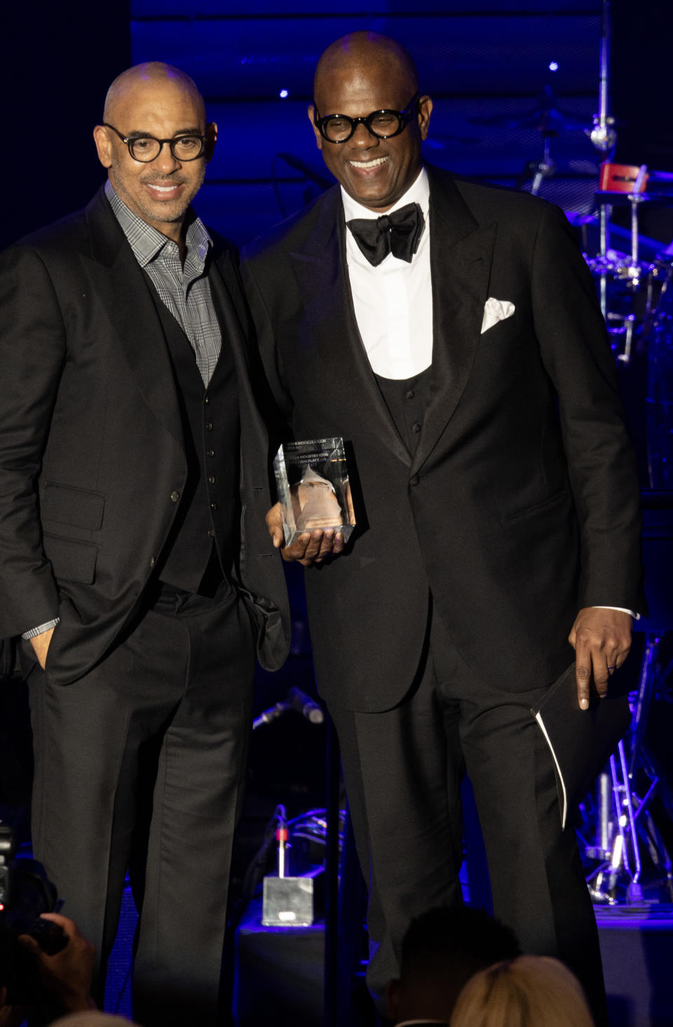 BEVERLY HILLS, CA - FEBRUARY 3, 2024: Honoree Jon Platt, right, accepts the Industry Icon award from Recording Academy Harvey Mason Jr. during the 66th Grammy Awards Pre-Grammy Gala at the Beverly Hilton on February 3, 2024 in Beverly Hills , California.(Gina Ferazzi / Los Angeles Times via Getty Images)