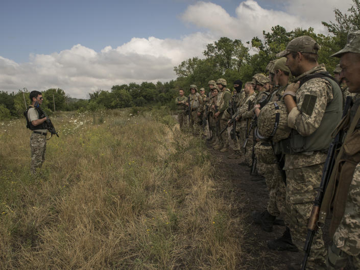 Rob, a member of the Mozart group, leads a military training of Ukrainian soldiers in rural Donbas, in eastern Ukraine, on July 23, 2022. (Laura Boushnak/The New York Times)