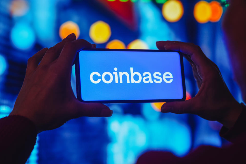  Coinbase logo is displayed on a smartphone screen. 