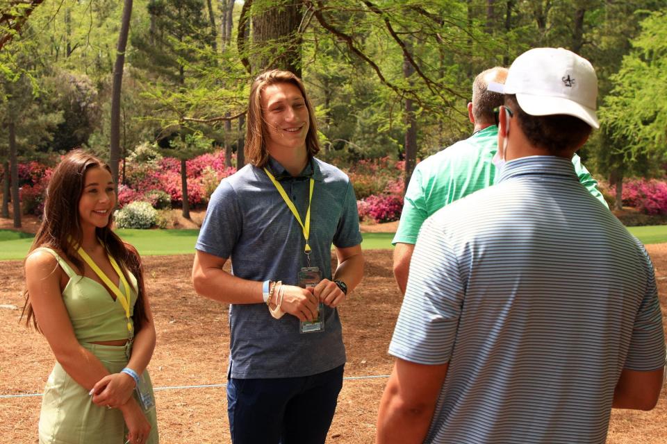 Trevor Lawrence and his wife Marissa talk with Kansas City quarterback Patrick Mahomes while both were visiting the Augusta National Golf Club to watch the 2021 Masters.