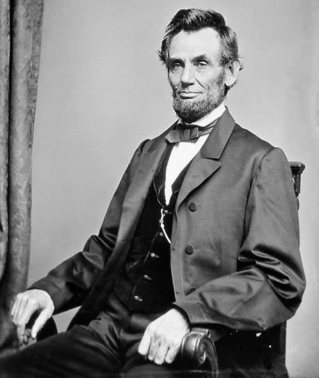 portrait of lincoln sitting on a chair