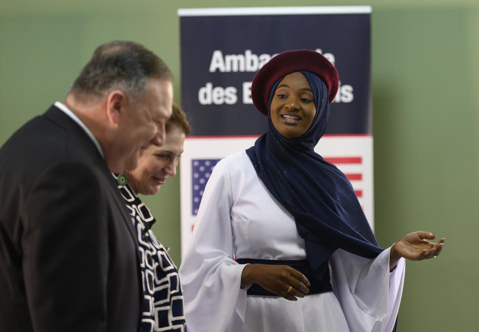 US Secretary of State Mike Pompeo and his wife Susan listen as "Startup Sunday" founder Mame Aminata Diambo gives him a tour of entrepreneurs who received assistance from the US Government programs, in Dakar, Senegal, Sunday, Feb. 16, 2020, part of Pompeo's first visit to sub-Saharan Africa during which he will seek to lay out a positive vision for US cooperation with the continent where China has been increasingly active. (Andrew Carballero-Reynolds/Pool Photo via AP)