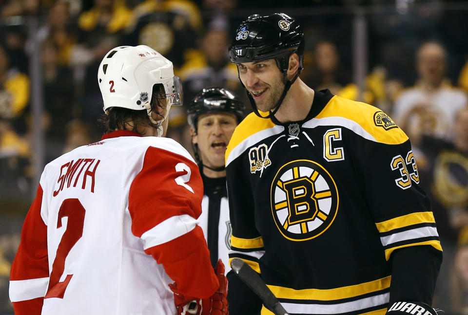 Boston Bruins' Zdeno Chara (33) stares at Detroit Red Wings' Brendan Smith during the first period of Game 2 of a first-round NHL hockey playoff series in Boston Sunday, April 20, 2014. (AP Photo/Winslow Townson)