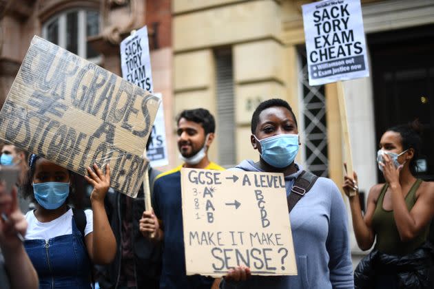 People take part in a protest in Westminster in London over the government's handling of A-level results. 