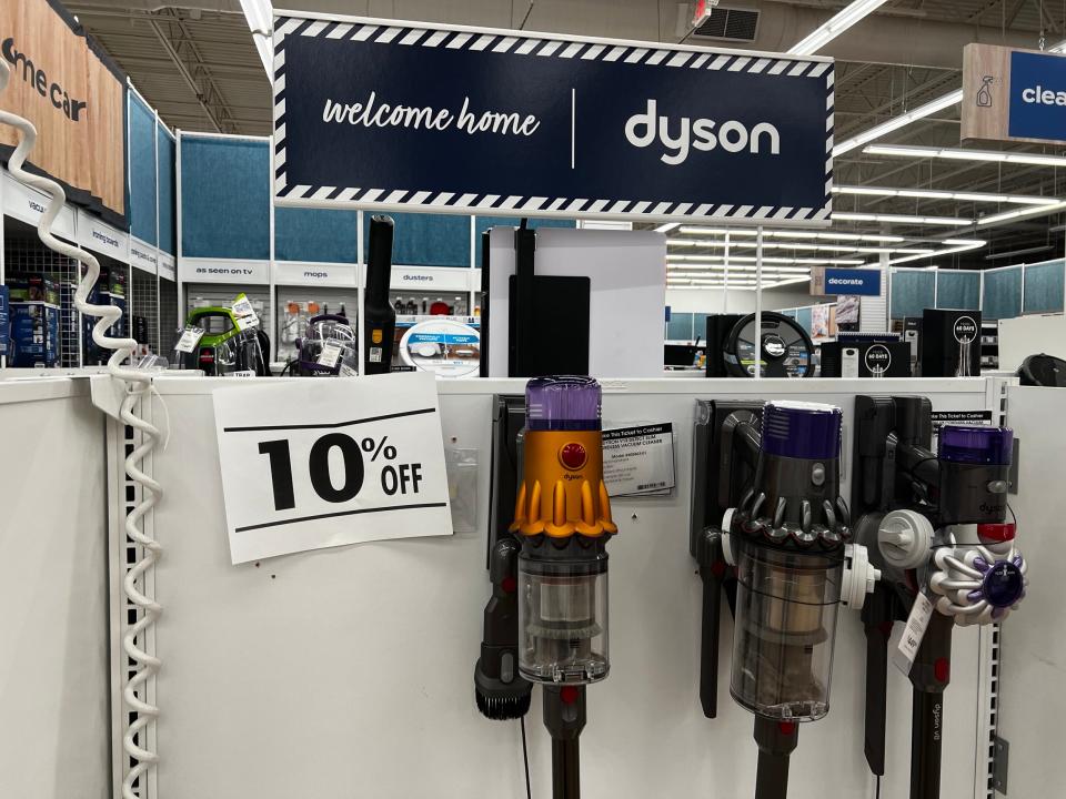 New discount signage on a Dyson vacuum display at a Bed Bath & Beyond store