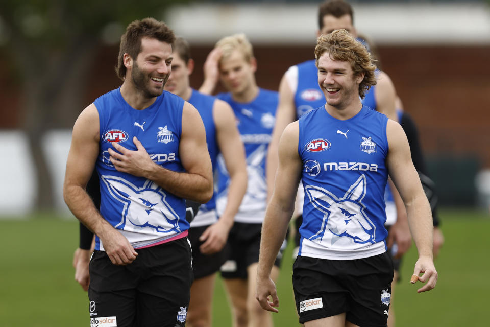 Luke McDonald and Jason Horne-Francis (pictured) share a laugh during a North Melbourne Kangaroos AFL training session.