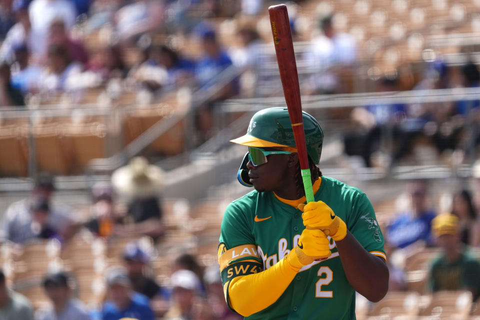 Oakland Athletics outfielder Lawrence Butler (2) bats against the Los Angeles Dodgers during the first inning at Camelback Ranch-Glendale on Feb. 25, 2024.