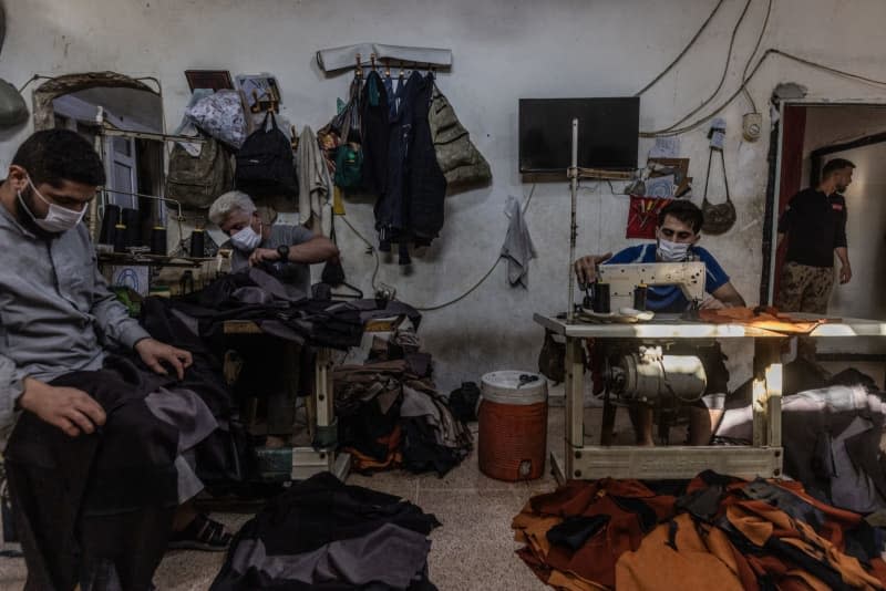Prisoners work as tailors as part of their sentences, inside the Military Police prison in Aleppo, which is designated for those who were charged with drug-related crimes. Anas Alkharboutli/dpa