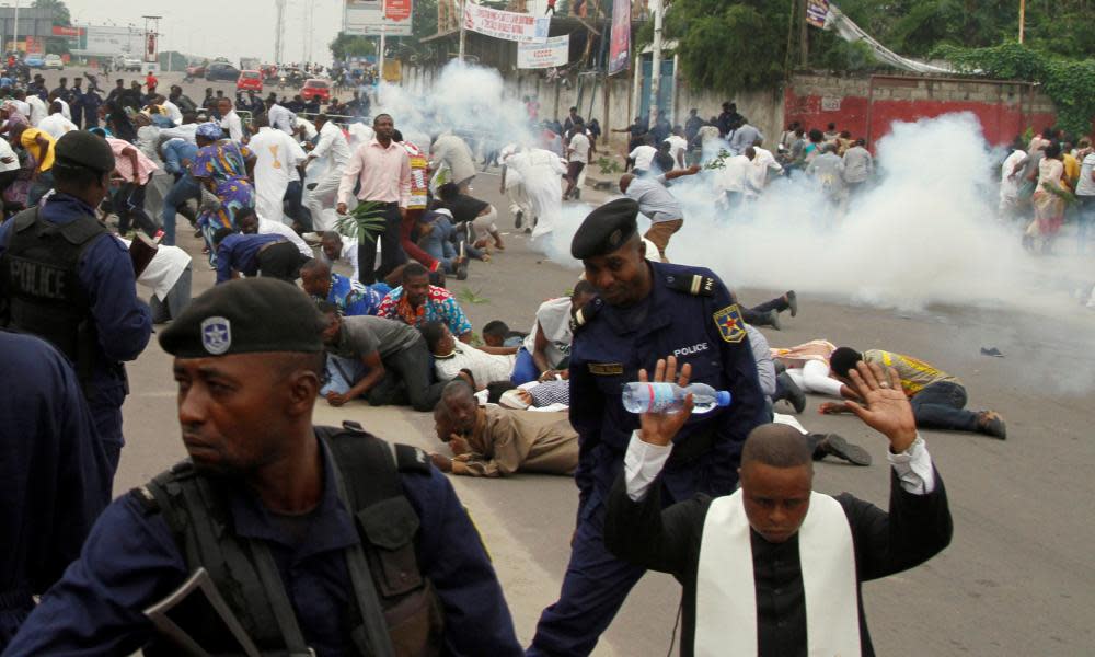 Riot policemen fire tear gas during a protest against the president, Joseph Kabila