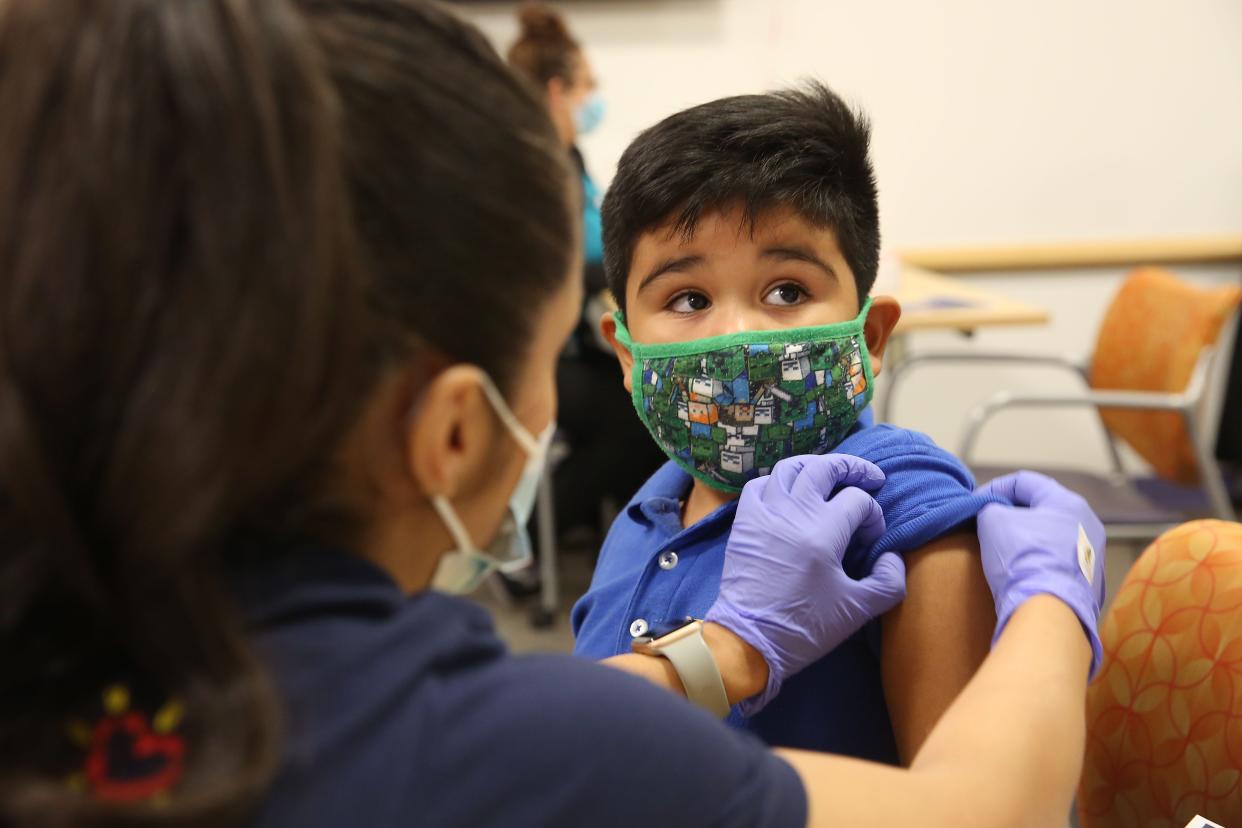 Pablo Peralta, 5 years old, receives his COVID-19 vaccine at the El Paso Children's Hospital in November 2021. Children ages 5 to 11 are eligible to receive their COVID-19 vaccines.