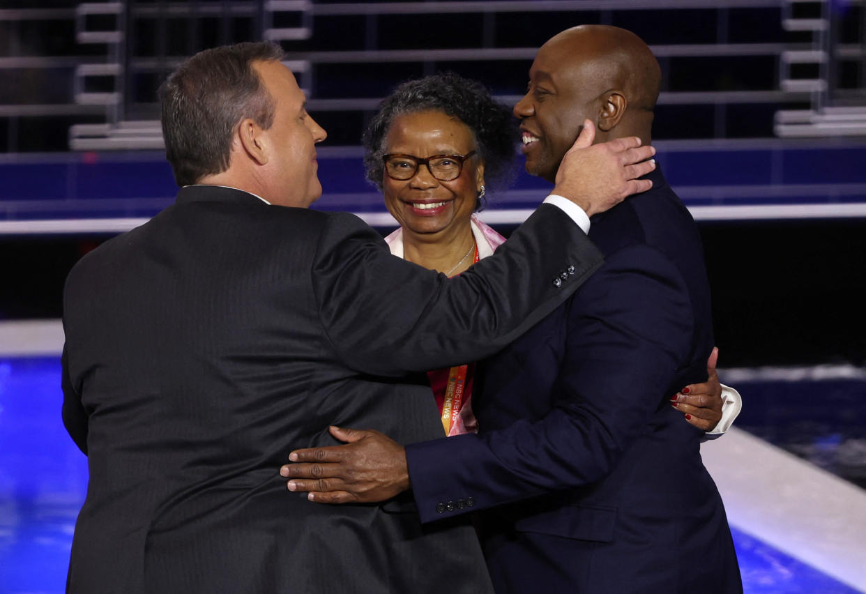 Former New Jersey Gov. Chris Christie and Scott, along with Scott's mother, after the conclusion of the third Republican presidential debate.