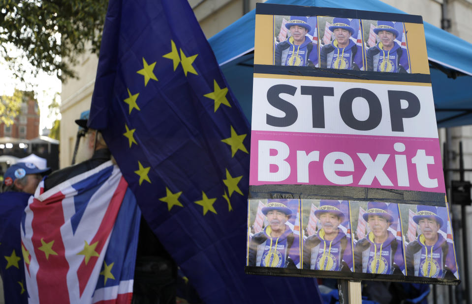 An anti Brexit demonstrators banner near Parliament in London, Tuesday, Oct. 22, 2019.British lawmakers from across the political spectrum were plotting Tuesday to put the brakes on Prime Minister Boris Johnson's drive to push his European Union divorce bill through the House of Commons in just three days, potentially scuttling the government's hopes of delivering Brexit by Oct. 31.(AP Photo/Kirsty Wigglesworth)