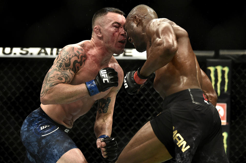 LAS VEGAS, NEVADA - DECEMBER 14:  (R-L) Kamaru Usman of Nigeria butts heads with Colby Covington in their UFC welterweight championship bout during the UFC 245 event at T-Mobile Arena on December 14, 2019 in Las Vegas, Nevada. (Photo by Chris Unger/Zuffa LLC via Getty Images)