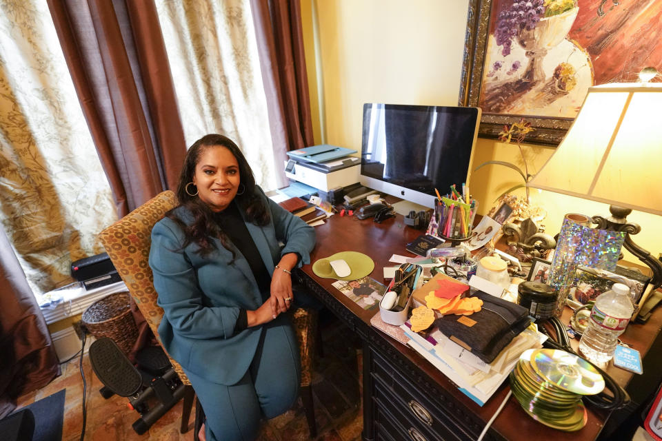 Ashley K. Shelton, executive director of Power Coalition for Equity & Justice in Louisiana, a voter advocacy organization that is trying to get left-leaning voters engaged for next year's elections, possess for a photo at her family home in Baton Rouge, La., Tuesday, Dec. 26, 2023. (AP Photo/Gerald Herbert)