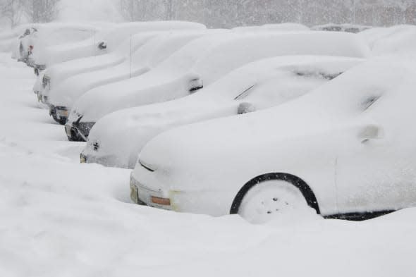 Cars buried in snow