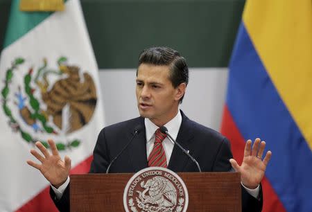 Mexico's President Enrique Pena Nieto gives a speech next to Colombian President Juan Manuel Santo (not pictured) during a news conference at the Los Pinos official residence in Mexico City, May 8, 2015. REUTERS/Henry Romero